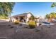 Expansive backyard with a pool, covered patio, and desert landscaping for outdoor enjoyment at 3403 E Kristal Way, Phoenix, AZ 85050