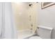 Bathroom with a shower-tub combo and white toilet, providing a functional space at 3403 E Kristal Way, Phoenix, AZ 85050