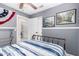 Bedroom featuring gray walls, ceiling fan, and natural light at 3403 E Kristal Way, Phoenix, AZ 85050