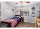 Bedroom featuring wood-look floors, ceiling fan, and natural light at 3403 E Kristal Way, Phoenix, AZ 85050
