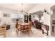 Bright dining room with sightlines to the living room and natural light at 3403 E Kristal Way, Phoenix, AZ 85050