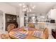 Open concept dining room with an elegant chandelier and views into the kitchen at 3403 E Kristal Way, Phoenix, AZ 85050