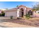 Charming single-story home featuring desert landscaping and a two-car garage at 3403 E Kristal Way, Phoenix, AZ 85050