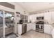 Bright kitchen with stainless appliances and an open view to a patio at 3403 E Kristal Way, Phoenix, AZ 85050