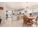 Bright eat-in kitchen boasting stainless steel appliances, a granite island, and backyard access at 3403 E Kristal Way, Phoenix, AZ 85050