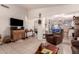 Inviting living room with tile floors, vaulted ceiling, and comfortable seating at 3403 E Kristal Way, Phoenix, AZ 85050