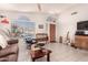 Bright living room with neutral walls, tile flooring, and natural light at 3403 E Kristal Way, Phoenix, AZ 85050