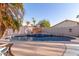 Refreshing swimming pool surrounded by lush palm trees in a private backyard oasis at 3403 E Kristal Way, Phoenix, AZ 85050
