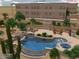 Backyard swimming pool with waterfall, a spa, an outdoor kitchen, desert vegetation, patio and lounge chairs at 36923 N 31St Ave, Phoenix, AZ 85086