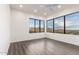 Bright bedroom with large windows showcasing scenic views, laminate floors, and ample natural light at 36923 N 31St Ave, Phoenix, AZ 85086