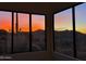Bedroom featuring picture windows showcasing the colors of the desert at sunset at 36923 N 31St Ave, Phoenix, AZ 85086