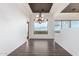 Dining room with hardwood floors, mountain views and stylish lighting fixture at 36923 N 31St Ave, Phoenix, AZ 85086