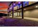 Exterior view of the home's multi-story construction, lighting, and desert landscaping at 36923 N 31St Ave, Phoenix, AZ 85086