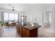 Staged kitchen with a spacious island, granite countertops, a ceiling fan, and desert views at 36923 N 31St Ave, Phoenix, AZ 85086