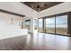 Bright living room with hardwood floors, mountain views, and modern lighting fixtures at 36923 N 31St Ave, Phoenix, AZ 85086