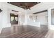 Large living room featuring hardwood floors and a modern ceiling fan at 36923 N 31St Ave, Phoenix, AZ 85086