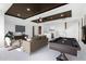 Spacious living room includes a pool table, bar, sofa, and entertainment area at 36923 N 31St Ave, Phoenix, AZ 85086