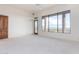 Bright main bedroom features mountain views, light-colored carpet and door to the outside at 36923 N 31St Ave, Phoenix, AZ 85086