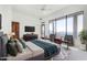 Nicely staged main bedroom with mountain views, two chairs, TV and a king-size bed at 36923 N 31St Ave, Phoenix, AZ 85086