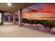 Wide-angle exterior shot of the home's covered patio with stunning sunset views at 36923 N 31St Ave, Phoenix, AZ 85086
