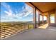 Extended outdoor patio with views of the natural desert landscape and bright blue sky at 36923 N 31St Ave, Phoenix, AZ 85086