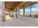 Spacious covered patio with expansive windows overlooking mountain views at 36923 N 31St Ave, Phoenix, AZ 85086
