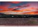 Sunset landscape shot of city view from behind the home's patio railing at 36923 N 31St Ave, Phoenix, AZ 85086