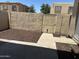 Enclosed backyard with mature landscaping and a gated entrance at 4424 E Pueblo Ave, Phoenix, AZ 85040