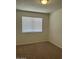 Cozy bedroom featuring carpeted floors and a window for natural light at 4424 E Pueblo Ave, Phoenix, AZ 85040