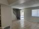 Spacious living room showcasing tiled flooring, staircase, and sunlit windows at 4424 E Pueblo Ave, Phoenix, AZ 85040
