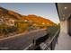 Balcony view of a mountain road lined with desert landscape and mountain views at 4725 N 56Th St, Phoenix, AZ 85018