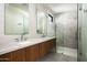 Contemporary bathroom featuring a double sink, tiled flooring, and modern tiled shower with glass door at 4725 N 56Th St, Phoenix, AZ 85018