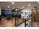 Upstairs bonus room with a pool table, full bar, wood flooring, and scenic night views at 4725 N 56Th St, Phoenix, AZ 85018