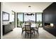 Bright dining room with modern lighting, fireplace, mountain views, and a long table with seating for eight at 4725 N 56Th St, Phoenix, AZ 85018