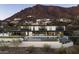Exterior showcasing an elegant modern home with a pool and views of the desert landscape at 4725 N 56Th St, Phoenix, AZ 85018
