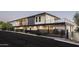 Modern home exterior featuring unique architectural details, a gated entry, and desert landscaping at 4725 N 56Th St, Phoenix, AZ 85018