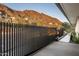 Sliding gate with views of the surrounding desert landscape and mountains at 4725 N 56Th St, Phoenix, AZ 85018