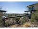 Modern home featuring an outdoor walking bridge with scenic views of mountains, palm trees, and the city at 4725 N 56Th St, Phoenix, AZ 85018