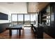 Luxurious game room boasts a modern pool table, stylish bar area, and panoramic city views from expansive windows at 4725 N 56Th St, Phoenix, AZ 85018