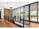 Upstairs hallway with modern railing, wood accent wall, wood flooring, and scenic mountain views at 4725 N 56Th St, Phoenix, AZ 85018