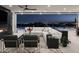 Elegant living room with a fireplace, comfortable seating, stunning city views at night, and an open layout at 4725 N 56Th St, Phoenix, AZ 85018