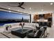 Inviting living room with comfortable seating, floor-to-ceiling windows, an open layout, and city views at dusk at 4725 N 56Th St, Phoenix, AZ 85018