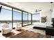 Bright main bedroom with floor-to-ceiling windows offering stunning city views, creating a serene and luxurious retreat at 4725 N 56Th St, Phoenix, AZ 85018