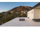 Spacious rooftop deck with a fire feature, lounge chairs, and stunning mountain views at 4725 N 56Th St, Phoenix, AZ 85018