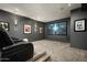 Private home theater offers plush seating, ambient lighting, and a large screen for immersive entertainment experiences at 4725 N 56Th St, Phoenix, AZ 85018