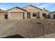 Charming single-story house with a two-car garage and low-maintenance desert landscaping at 4824 W Saint John Rd, Glendale, AZ 85308