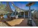 Relaxing back patio shaded by canvas, with dining set and heater, perfect for outdoor entertaining at 556 W Kiva Ave, Mesa, AZ 85210