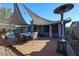 Outdoor deck with dining table, shade, and outdoor heater at 556 W Kiva Ave, Mesa, AZ 85210