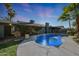 Beautiful pool featuring a charming fountain, creating a serene oasis in the backyard at 556 W Kiva Ave, Mesa, AZ 85210