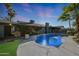 Beautiful pool featuring a charming fountain, creating a serene oasis in the backyard at 556 W Kiva Ave, Mesa, AZ 85210